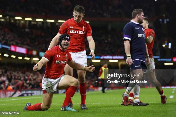 Leigh Halfpenny of Wales celebrates with Josh Adams after scoring his second try during the NatWest Six Natons match between Wales and Scotland at...