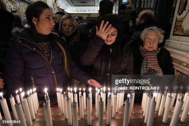 People pray during Candelora festival at Montevergine Sanctuary in Ospidaletto d'Alpinolo a little village in the south of Italy. The Sanctuary was...