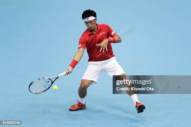 Yuichi Sugita of Japan plays a forehand in his singles match against Fabio Fognini of Italy during day three of the Davis Cup World Group first round...