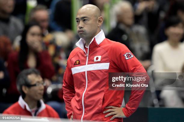 Team captain Satoshi Iwabuchi of Japan reacts as he watches the singles match between Yuichi Sugita of Japan and Fabio Fognini of Italy during day...