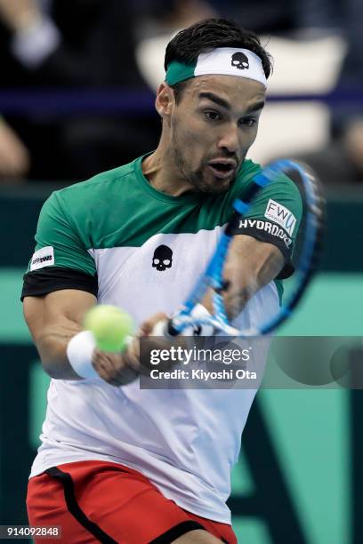 Fabio Fognini of Italy plays a backhand in his singles match against Yuichi Sugita of Japan during day three of the Davis Cup World Group first round...