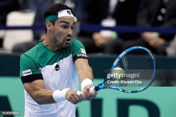 Fabio Fognini of Italy plays a backhand in his singles match against Yuichi Sugita of Japan during day three of the Davis Cup World Group first round...