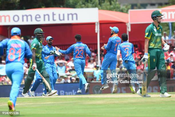 India celebrate the wicket of Kagiso Rabada of the Proteas during the 2nd Momentum ODI match between South Africa and India at SuperSport Park on...
