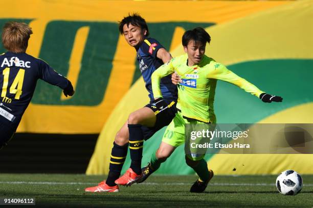 Asahi Yada of JEF United Chiba and Shinnosuke Nakatani of Kashiwa Reysol compete for the ball during the preseason friendly match between JEF United...