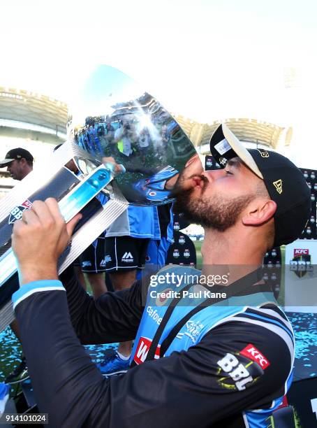 Jake Weatherald of the Strikers kisses the trophy after winning the Big Bash League Final match between the Adelaide Strikers and the Hobart...