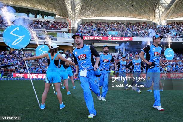 The Strikers run onto the ground to take to the field during the Big Bash League Final match between the Adelaide Strikers and the Hobart Hurricanes...