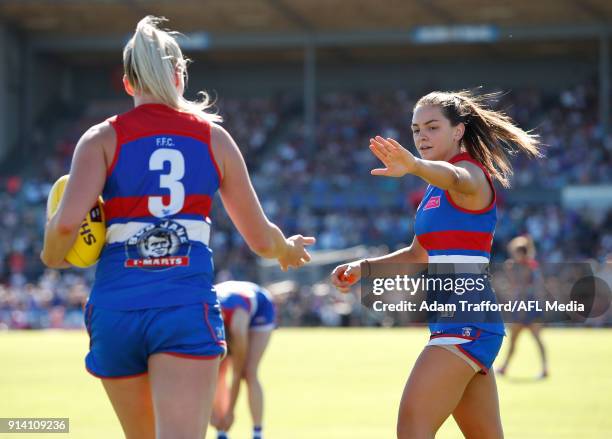 Monique Conti of the Bulldogs high fives Katie Brennan of the Bulldogs on the 3 quarter time siren during the 2018 AFLW Round 01 match between the...