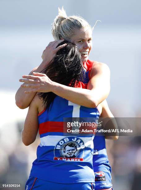 Katie Brennan of the Bulldogs congratulates Brooke Lochland of the Bulldogs on a goal during the 2018 AFLW Round 01 match between the Western...