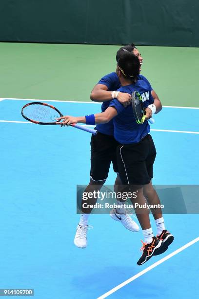 Francis Casey Alcantara and Jurence Zosimo Mendoza of Philippines celebrate victory after beating Justin Barki and David Agung Susanto of Indonesia...