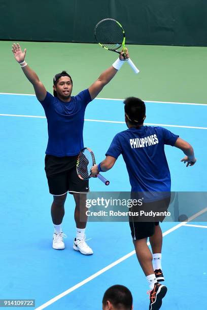 Francis Casey Alcantara and Jurence Zosimo Mendoza of Philippines celebrate victory after beating Justin Barki and David Agung Susanto of Indonesia...