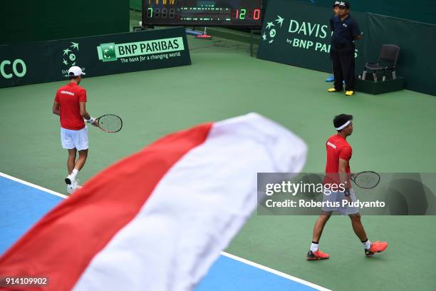 Justin Barki and David Agung Susanto of Indonesia compete against Francis Casey Alcantara and Jurence Zosimo Mendoza of Philippines during the first...