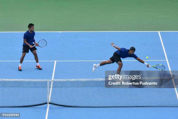 Francis Casey Alcantara and Jurence Zosimo Mendoza of Philippines compete against Justin Barki and David Agung Susanto of Indonesia during the first...