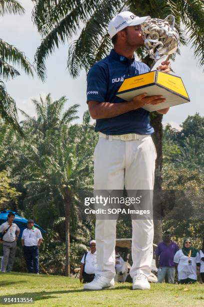 Shubhankar Sharma pro golf player from India poses with the Maybank Championship trophy after he won by the score of 21 under 267 during day four....