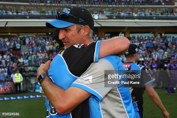 Jason Gillespie, head coach of the Strikers embraces Michael Neser after winning the Big Bash League Final match between the Adelaide Strikers and...