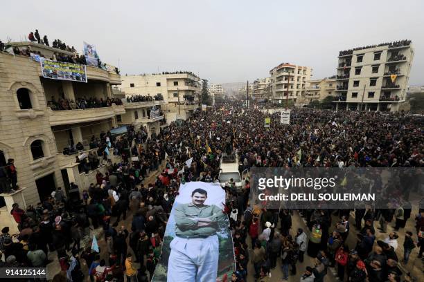 Syrian Kurds march in the northern Syrian city of Afrin during a demonstration on February 4, 2018 denouncing the military operation by the Turkish...
