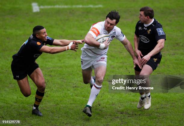 Matt Smith of Leicester Tigers tackled by Marcus Watson and Brendan Macken of Wasps during the Anglo-Welsh Cup match between Wasps and Leicester...