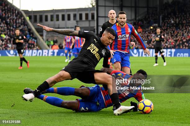 Kenedy of Newcastle United is challenged by Timothy Fosu-Mensah of Crystal Palace during the Premier League match between Crystal Palace and...