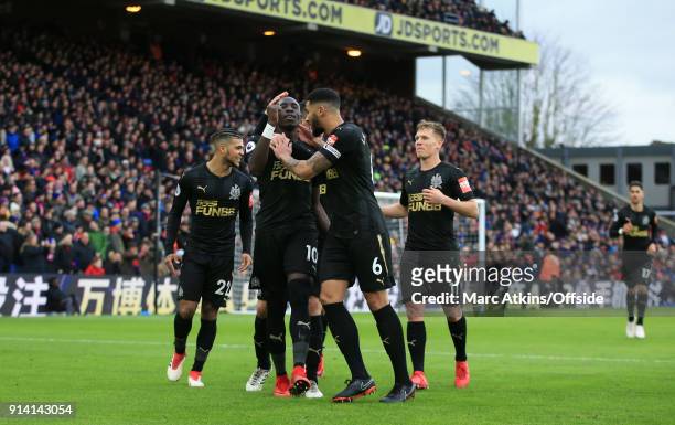 Mohamed Diame of Newcastle United celebrates scoring the opening goal with team mates during the Premier League match between Crystal Palace and...