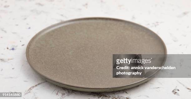 pottery platter on decorative surface. - 2017 243 stock pictures, royalty-free photos & images
