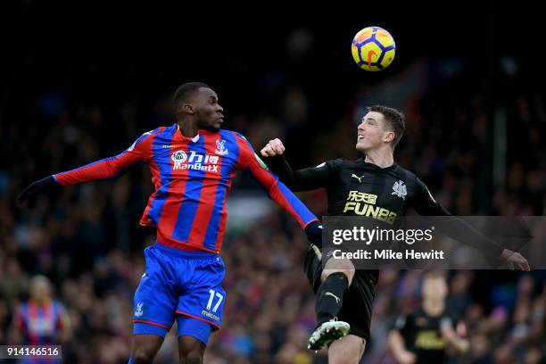 Christian Benteke of Crystal Palace competes for a header with Ciaran Clark of Newcastle United during the Premier League match between Crystal...