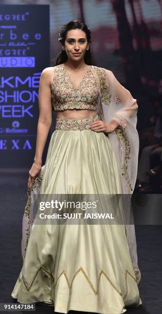 Indian Bollywood actress Karishma Kapoor showcases a creation by designer Ravi Bhalotia at the Lakmé Fashion Week Summer Resort 2018 in Mumbai on...