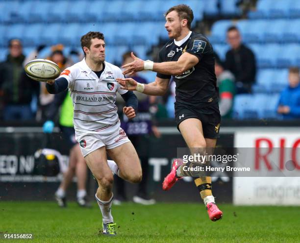Josh Bassett of Wasps and Jonah Holmes of Leicester Tigers during the Anglo-Welsh Cup match between Wasps and Leicester Tigers at Ricoh Arena on...