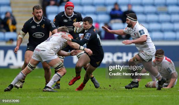 Owain James of Wasps tackled by Luke Hamilton of Leicester Tigers during the Anglo-Welsh Cup match between Wasps and Leicester Tigers at Ricoh Arena...