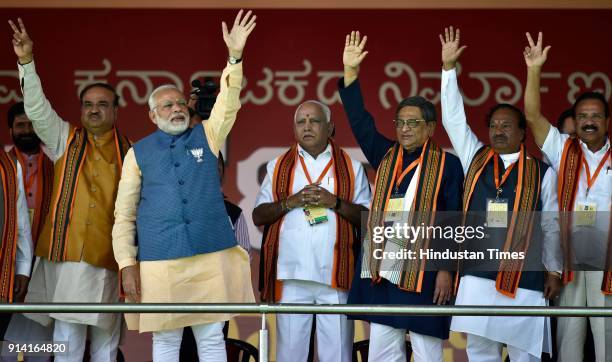 Union minister Ananth Kumar, Prime Minister Narendra Modi, Karnataka BJP president and chief ministerial candidate B S Yeddyurappa, S M Krishna,...