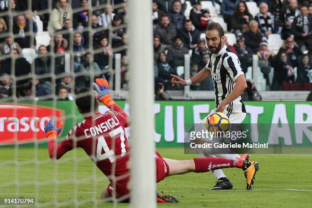 Gonzalo Higuain of Juventus FC scores a goal during the serie A match between Juventus and US Sassuolo on February 4, 2018 in Turin, Italy.