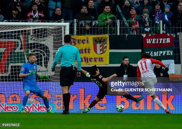 Augsburg's Austrian forward Michael Gregoritsch scores the second goal during the German first division Bundesliga football match 1 FC Augsburg vs...