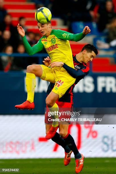 Nantes' Brazilian midfielder Andrei Girotto vies for the ball with Caen's Belgian midfielder Stef Peeters during the French L1 football match between...