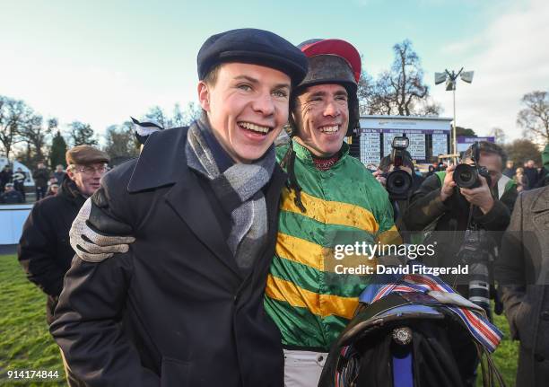 Dublin , Ireland - 4 February 2018; Jockey Derek O'Connor with trainer Joseph O'Brien the parade ring after winning the Unibet Irish Gold Cup on...