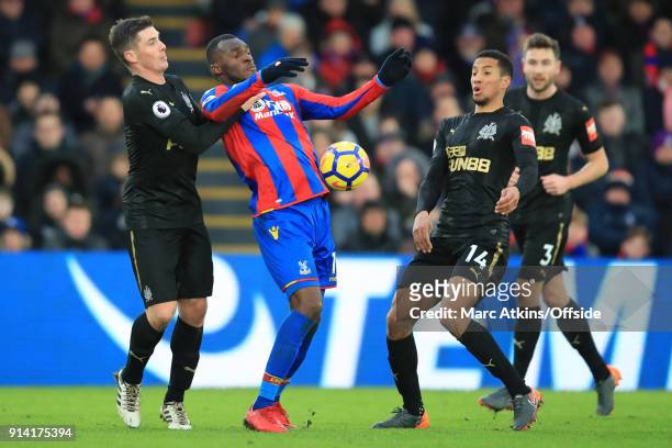 Christian Benteke of Crystal Palace in action with Ciaran Clark, Isaac Hayden and Paul Dummett of Newcastle United during the Premier League match...