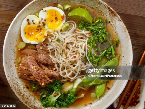 beef ramen noodle and vegetable soup with a soft boiled egg - vietnamese cuisine stock pictures, royalty-free photos & images
