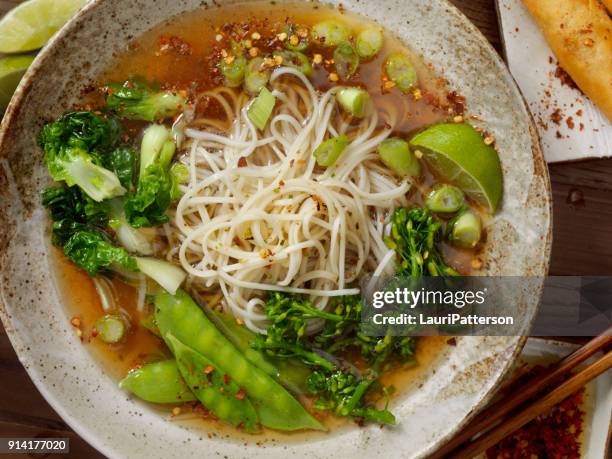 ramen noodle and vegetable soup - noodle soup stock pictures, royalty-free photos & images