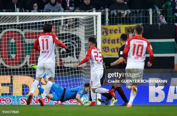 Augsburg's German forward Marco Richter scores the third goal during the German first division Bundesliga football match 1 FC Augsburg vs Eintracht...