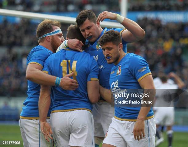 Tommaso Benvenuti with his teammates of Italy celebrate after the team's first try during the NatWest Six Nations match between Italy and England at...