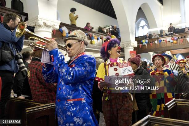 Clowns perform as they arrive for the annual Grimaldi Memorial Service at the All Saints church in east London on February 4, 2018. The service takes...