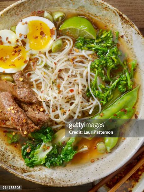 beef ramen noodle and vegetable soup with a soft boiled egg - soft boiled egg stock pictures, royalty-free photos & images