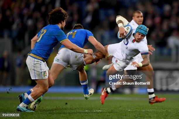 Jack Nowell of England is tackled by Tommaso Benvenuti of Italy during the NatWest Six Nations round One match between Italy and Engalnd at Stadio...