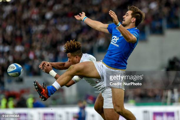 Tommaso Benvenuti of Italy is challenged by Anthony Watson of England during the NatWest Six Nations 2018 match between Italy and England at Stadio...