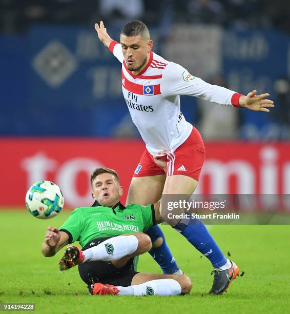Kyriakos Papadopoulos of Hamburg is challenged by Niclas Fllkrug of Hannover during the Bundesliga match between Hamburger SV and Hannover 96 at...