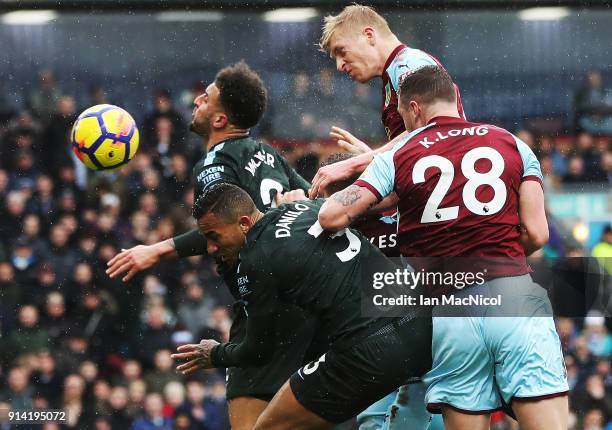 Ben Mee of Burnley heads at goal during the Premier League match between Burnley and Manchester City at Turf Moor on February 3, 2018 in Burnley,...