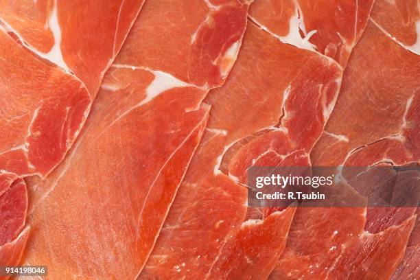 slices of fresh prosciutto meat - prosciutto stock pictures, royalty-free photos & images