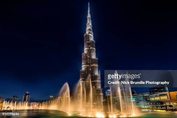 burj khalifa at night, dubai, united arab emirates - dubai fountain stock pictures, royalty-free photos & images