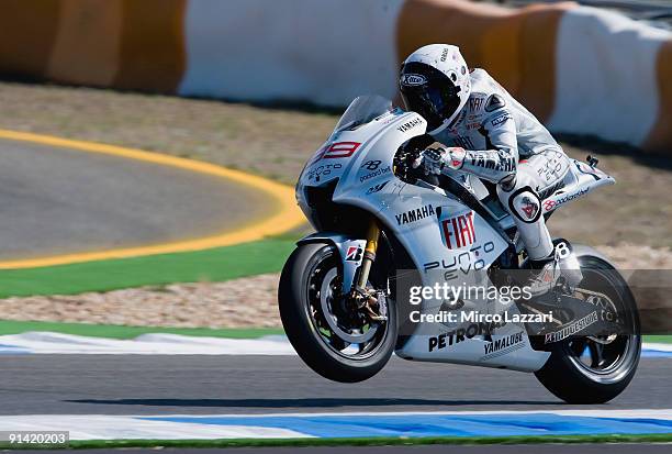Jorge Lorenzo of Spain and Fiat Yamaha Team lifts the front wheel during the MotoGP race of the Grand Prix of Portugal in Estoril Circuit on October...