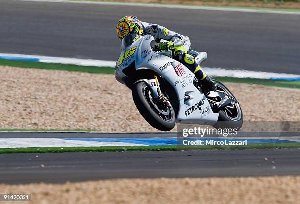 Valentino Rossi of Italy and Fiat Yamaha Team lifts the front wheel during the MotoGP race of the Grand Prix of Portugal in Estoril Circuit on...