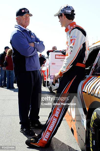 Joey Logano , driver of the Home Depot Toyota, talks with car owner Joe Gibbs on the grid prior to the NASCAR Sprint Cup Series Price Chopper 400...