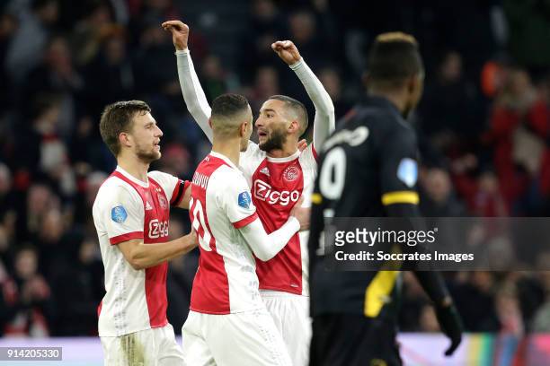 Hakim Ziyech of Ajax celebrates 3-1 with Noussair Mazraoui of Ajax, Joel Veltman of Ajax during the Dutch Eredivisie match between Ajax v NAC Breda...