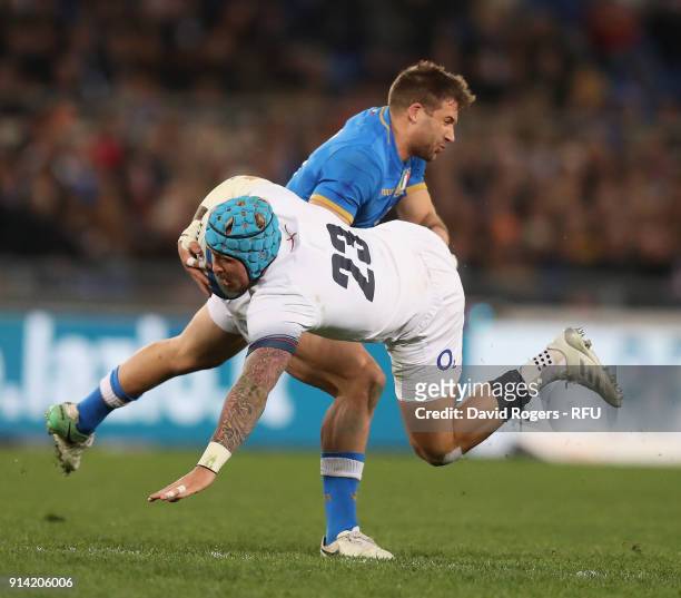 Jack Nowell of England is tackled by Tommaso Benvenuti during the NatWest Six Nations match between Italy and England at Stadio Olimpico on February...